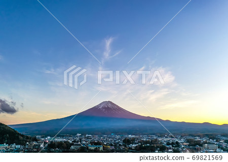 Aerial view over lake Kawaguchi, located in the border Fujikawaguchiko and Minobu, southern Yamanashi Prefecture near Mount Fuji, Japan. Lake Kawaguchi is a very popular tourist spot near Fuji Japan. Aerial view over lake Kawaguchi, located in the border Fujikawaguchiko and Minobu, southern Yamanashi Prefecture near Mount Fuji, Japan. Lake Kawaguchi is a very popular tourist spot near Fuji Japan. 69821569