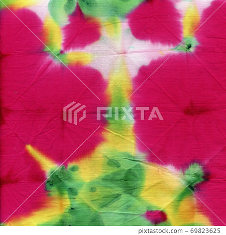 Tie dyed pattern on cotton fabric for background. Tie dyed pattern on cotton fabric for background. 69823625