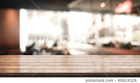 Empty wooden table top with lights bokeh on blur restaurant background Empty wooden table top with lights bokeh on blur restaurant background 69824326