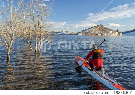 paddling stand up paddleboard in winter paddling stand up paddleboard in winter 69826367
