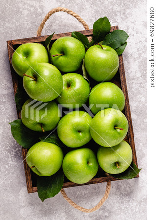 Ripe green apples in wooden box. Ripe green apples in wooden box. 69827680