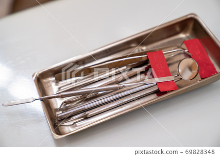 sanitized metal tools for job of a dentist 69828348
