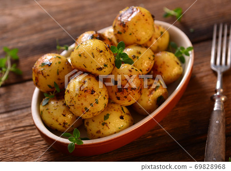 Roasted young potatoes Roasted young potatoes 69828968