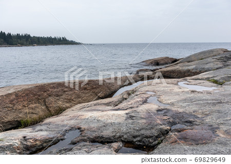 Sweden rocky sea side. Northern cloudy landscape Sweden rocky sea side. Northern cloudy landscape 69829649