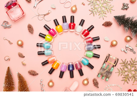 christmas concept, new year, manicure with nail polish, pedicure on pink background, copy space, Flat Lay 69830541