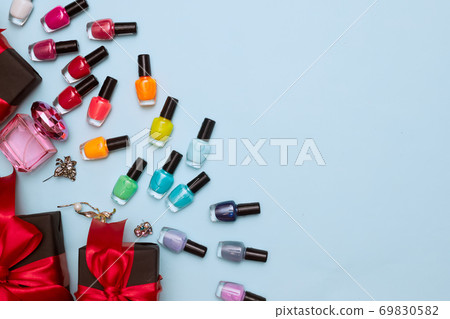 black friday concept, manicure with nail polish, pedicure on blue background, copy space, flat lay 69830582