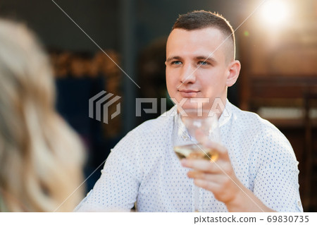 man. romantic dinner. lovers drink wine. man. romantic dinner. lovers drink wine. 69830735