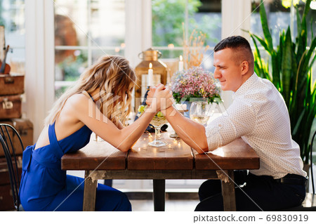 two lovers out who's in charge at romantic dinner 69830919