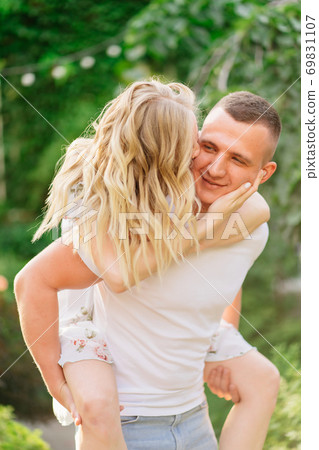 beautiful and happy couple having fun in garden. 69831107