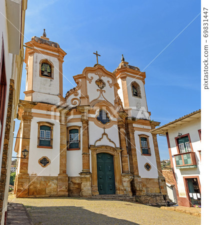 Facade of preserved historic 18th century church in colonial architecture 69831447