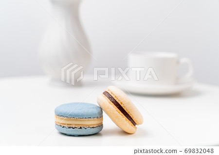 macarons on background Cup and vase. 69832048