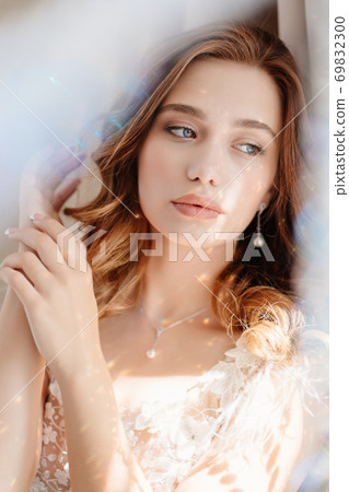 close-up sun glare. beautiful woman with long hair 69832300