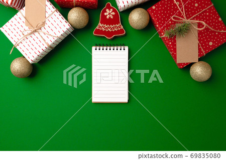 Top view of decorated Christmas gift and gingerbread cookie Top view of decorated Christmas gift and gingerbread cookie 69835080