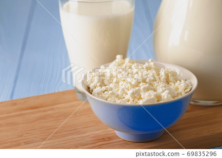 Glass of milk with bowl of cottage cheese Glass of milk with bowl of cottage cheese 69835296