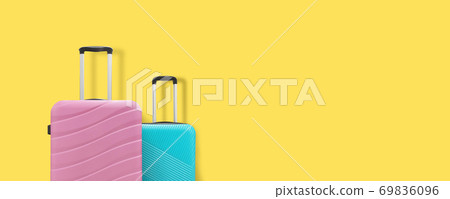 Two suitcases on a yellow background. Copy space 69836096