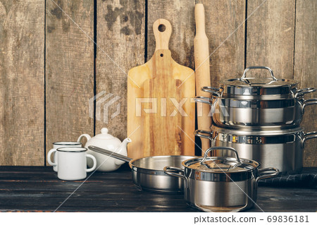 Set of dishware against old wooden background 69836181