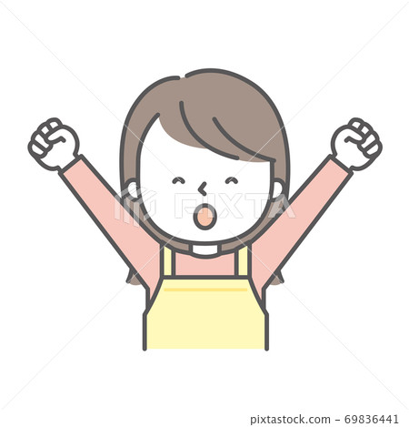 A woman in an apron raising her fists in both hands A woman in an apron raising her fists in both hands 69836441