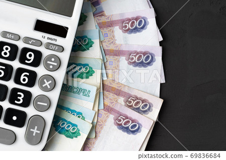 Close up photo of stack of Russian money rubles with calculator 69836684