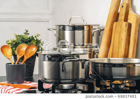 Clean saucepan on a gas stove in kitchen Clean saucepan on a gas stove in kitchen 69837481