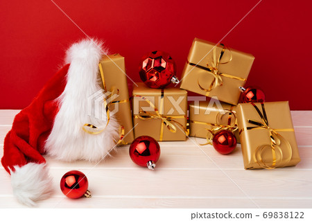 Christmas gift boxes against red background front view 69838122
