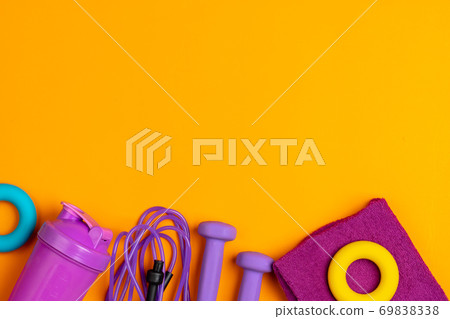 Assortment of sport equipment on yellow background, top view 69838338