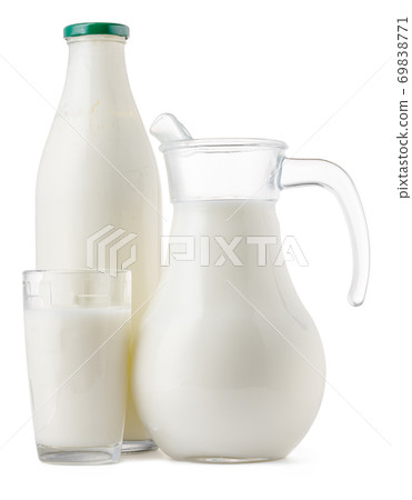 Glassware full of fresh milk isolated on white Glassware full of fresh milk isolated on white 69838771