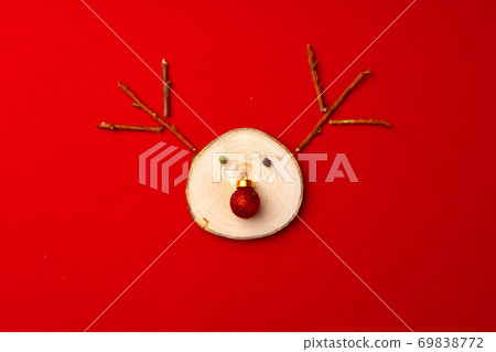 Christmas background with reindeer decoration on red Christmas background with reindeer decoration on red 69838772