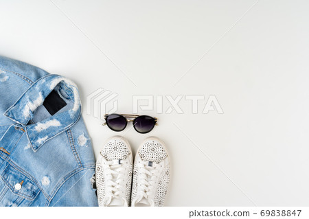 Flat lay of woman summer outfit on white background 69838847