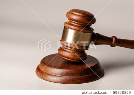 Wooden judges gavel on table close up 69838899