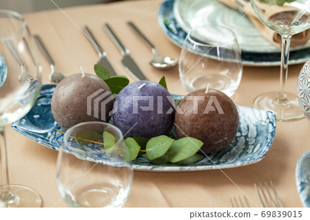 Round candles, beautiful table setting close up 69839015