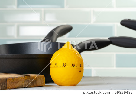 Clean and dry cooking pans on a kitchen counter Clean and dry cooking pans on a kitchen counter 69839483