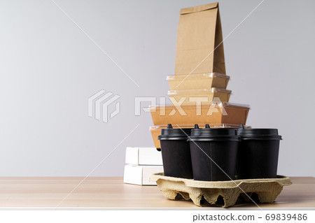 Many various take-out food containers, pizza box, coffee cups and paper bags on light grey background Many various take-out food containers, pizza box, coffee cups and paper bags on light grey background 69839486