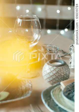 Empty wine glass on a restaurant table 69839784