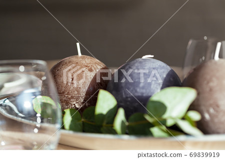 Round candles, beautiful table setting close up Round candles, beautiful table setting close up 69839919