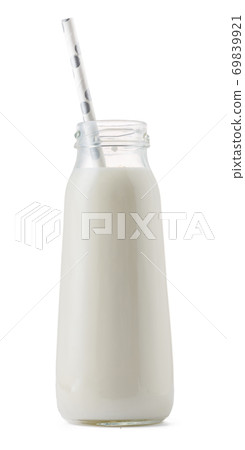 Glass cup of milk with a straw isolated on white Glass cup of milk with a straw isolated on white 69839921