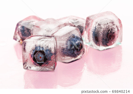 Ice cubes with berry for summer cocktails Ice cubes with berry for summer cocktails 69840214
