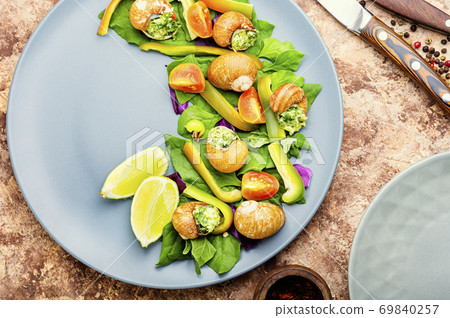 Salad with vegetables and snails Salad with vegetables and snails 69840257