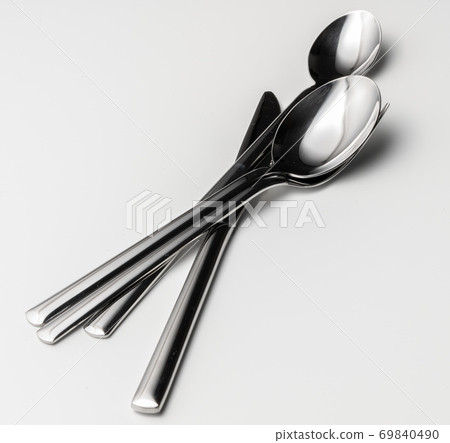 Spoon, fork and knife on a white background 69840490