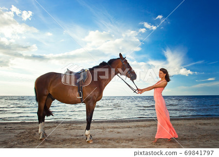 girl with horse on seacoast girl with horse on seacoast 69841797