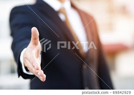 Business people ask to shake hands to do business 69842929