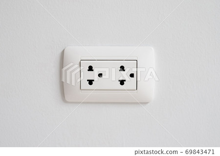 A white socket on the wall. A white socket on the wall. 69843471