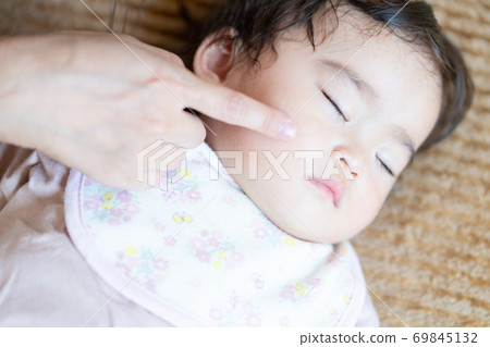 Sleeping baby and mom's hands Sleeping baby and mom's hands 69845132