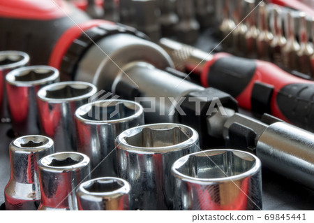 a set of metal heads with bit of key and screwdriver inside tool box. a set of metal heads with bit of key and screwdriver inside tool box. 69845441