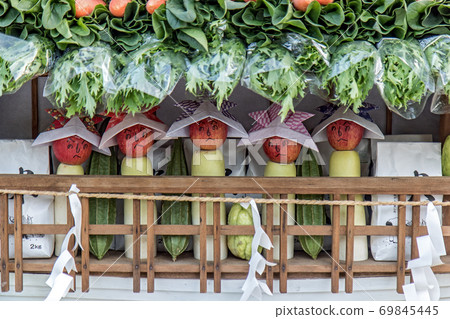 Funny Apples like dolls are standing in table a shop. Funny Apples like dolls are standing in table a shop. 69845445