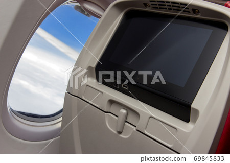 seat with a monitor at flying air plane seat with a monitor at flying air plane 69845833