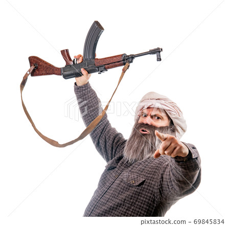 The bearded man armed with kalashnikov isolated on a white background.  69845834