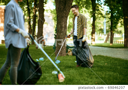 Two men collects plastic garbage, volunteering 69846207