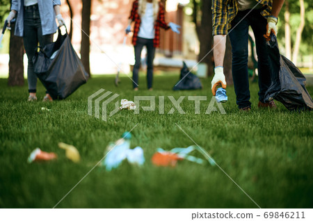 People collects plastic garbage, volunteering People collects plastic garbage, volunteering 69846211