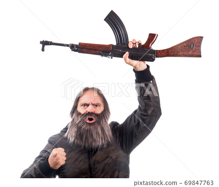 The bearded man rise kalashnikov isolated on a white background. The bearded man rise kalashnikov isolated on a white background. 69847763
