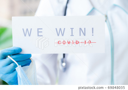 Covid-19, doctor holds a form with the text we win Covid-19, doctor holds a form with the text we win 69848035